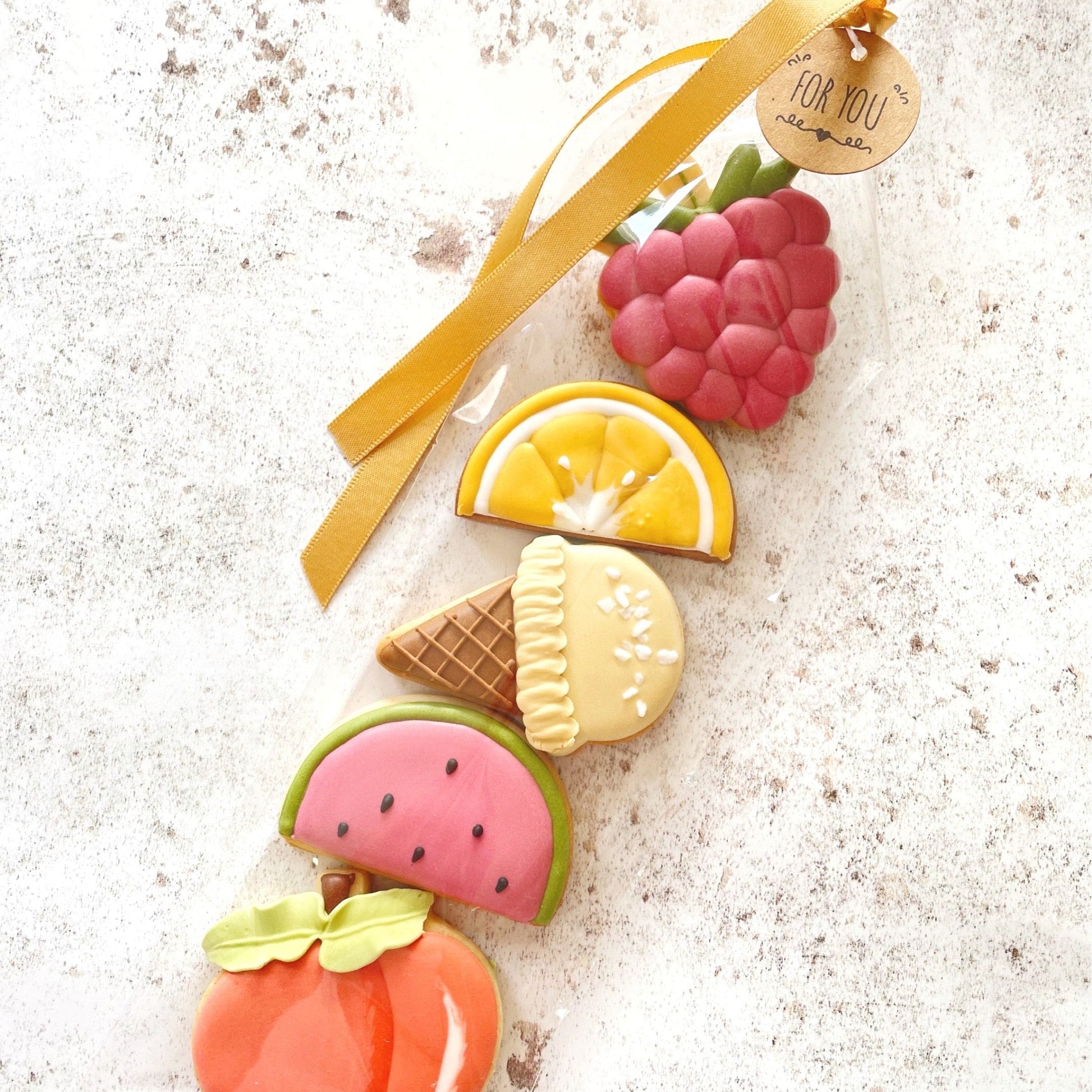 Summer Fruit Mini Iced Biscuits hand decorated, Summer Fruit Mini Iced Biscuits hand decorated, Garden Themed Biscuits hand decorated, Summer themed biscuits, Biscuit gift box, custom iced biscuits, Raspberry cookies, heart-shaped biscuits, Brighton bakery. Lemon biscuits, Fruit biscuits